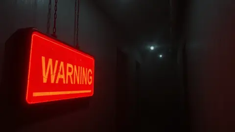 Glowing red warning shape in a dark foggy corridor with flickering lights