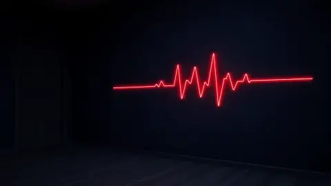 Glowing red heartbeat-style line on a dark wall in a dim room
