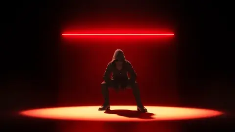 Player crouching beneath a horizontal red laser beam in a dark room
