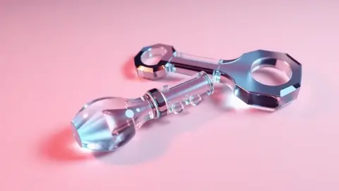 Two nearly identical glass keys, one slightly different in shape