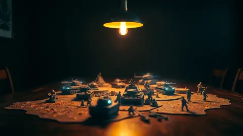 Holographic tanks and helicopter hovering above a tabletop with miniature terrain